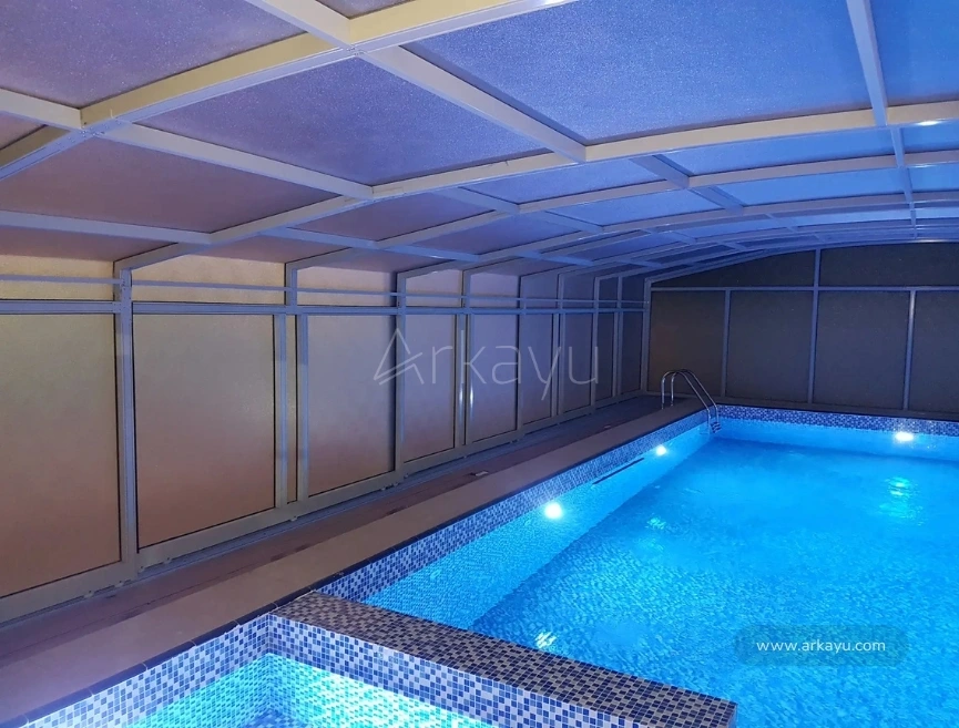 arkayu swimming pool retractable enclosure for a residence in Abu Dhabi, UAE